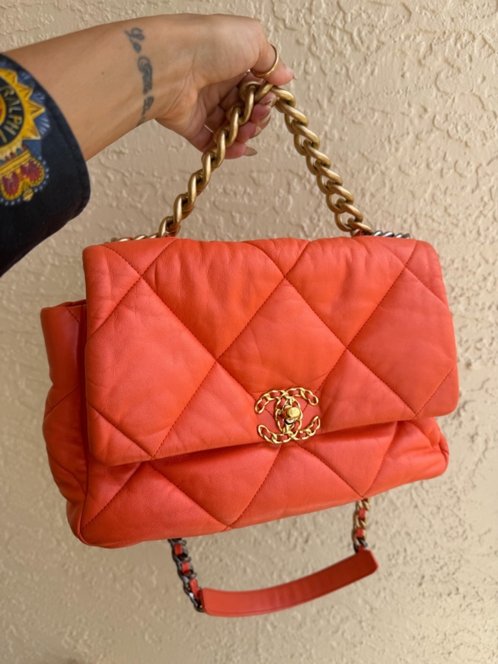CHANEL 19
Orange Quilted Lambskin Leather Large